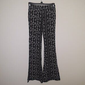 Justice girls size 14 black/white pattern,stretchy logo pants w/flare bottoms